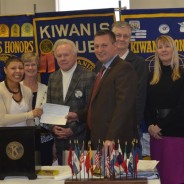 Chase Venable, President of the Downtown Kiwanis Club of Paducah presents a $500 check to Stacy Thomas, Coordinator of the Mustangs Youth Services Center.